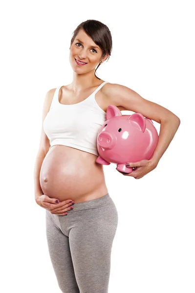 임신 젊은 여성 돼지 저금통, 절연을 — 스톡 사진