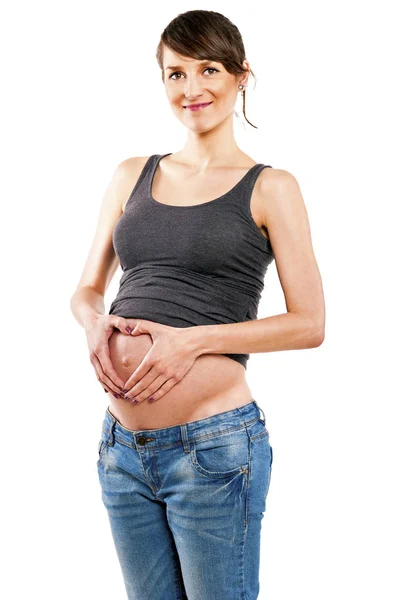 Счастливая беременная женщина - изолированы на белом фоне — стоковое фото