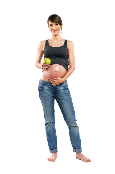 Kobieta w ciąży na białym tle nad białym tle z apple. — Zdjęcie stockowe