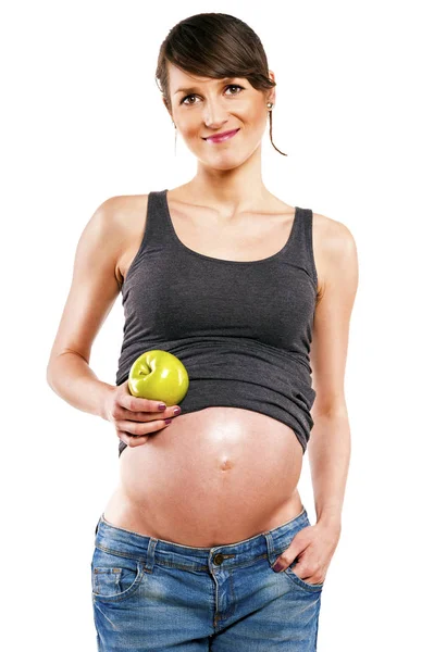 Gravid kvinna isolerade över vit bakgrund med apple. — Stockfoto