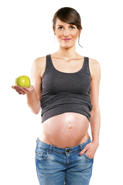Gravid kvinna isolerade över vit bakgrund med apple. — Stockfoto