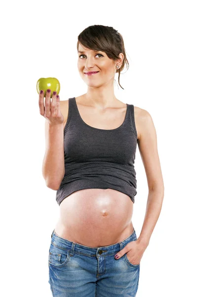 Gravid kvinna isolerade över vit bakgrund med apple. Stockbild