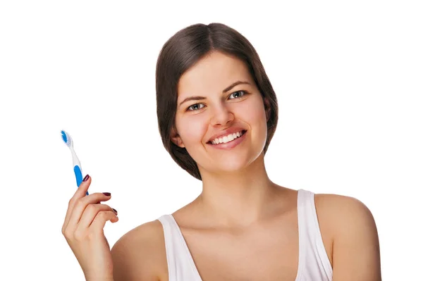 Beautiful smiling woman cleaning her teeth with a toothbrush in — Stock Photo, Image