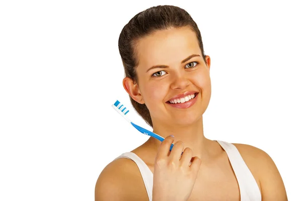 Młoda kobieta szczotkowanie zębów nad biały backgrund. — Zdjęcie stockowe