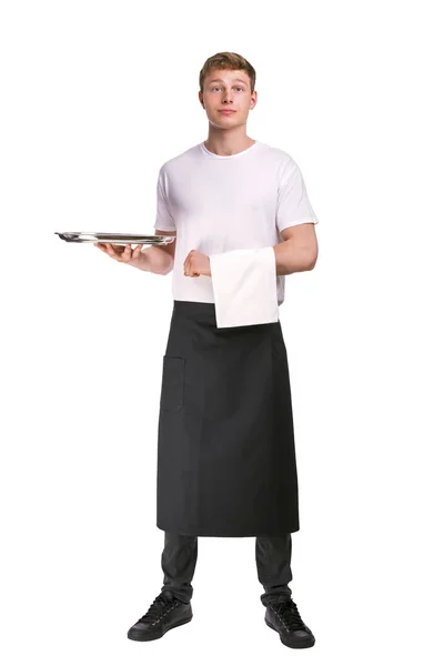 年轻英俊服务员用餐巾站在白色背景上 — 图库照片