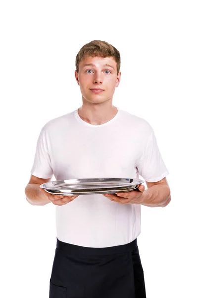 Young handsome waiter standing on white background — Stock Photo, Image