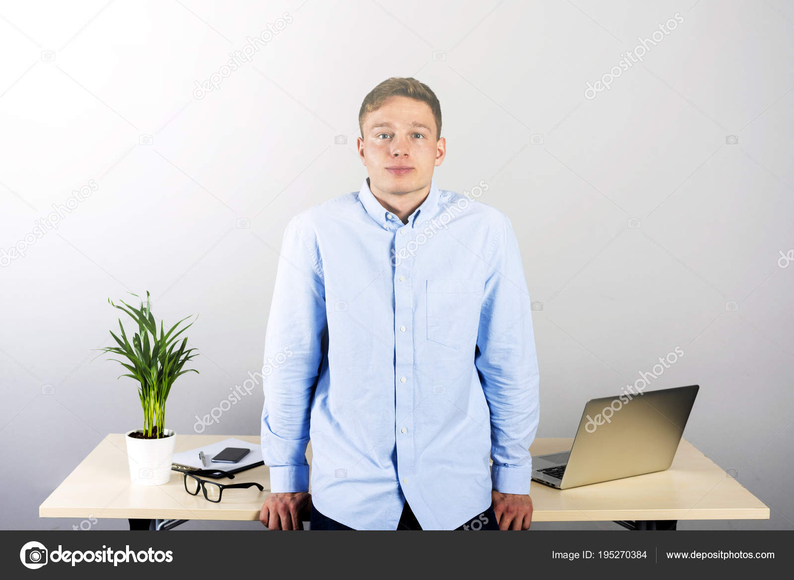 Office Man Standing By Desk Smilling Stock Photo C Wisiel 195270384