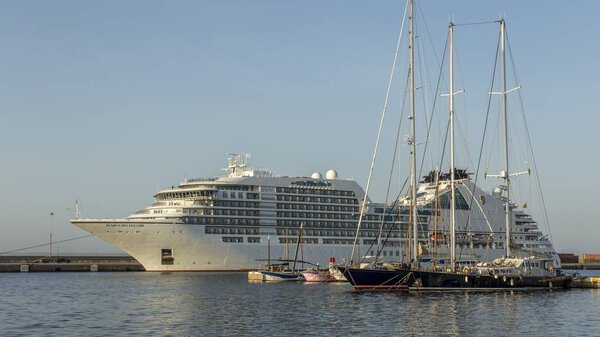 Big cruise ship in harbor Palamos in Spain, Seabourn Encore from Bahamas , length 210m, passengers 592, August 04, 2017 Spain