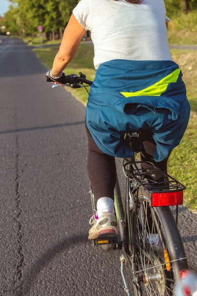 Biker in summertime on the asphalt road — Stock Photo, Image