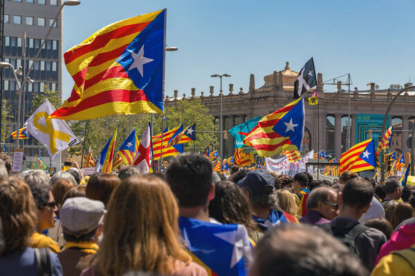 Catalan demonstrators with national catalan symbols in Barcelona to support the freedom of the political prisoners