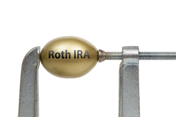 Golden Egg in Metal Clamp - Roth IRA — Stock Photo, Image