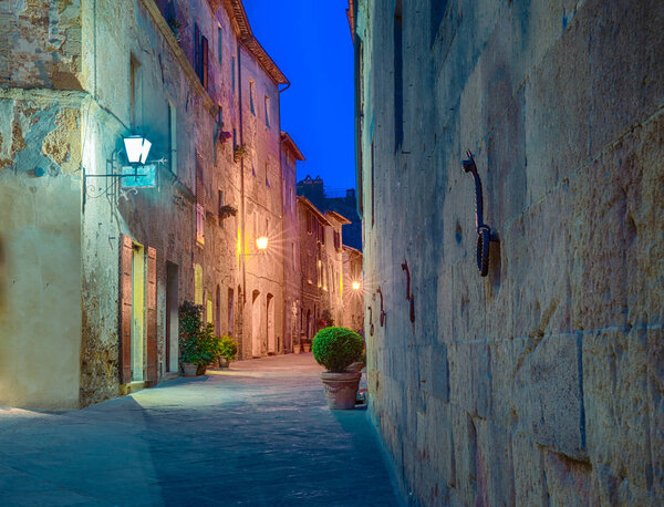 Street in Pienza, Italy at night.