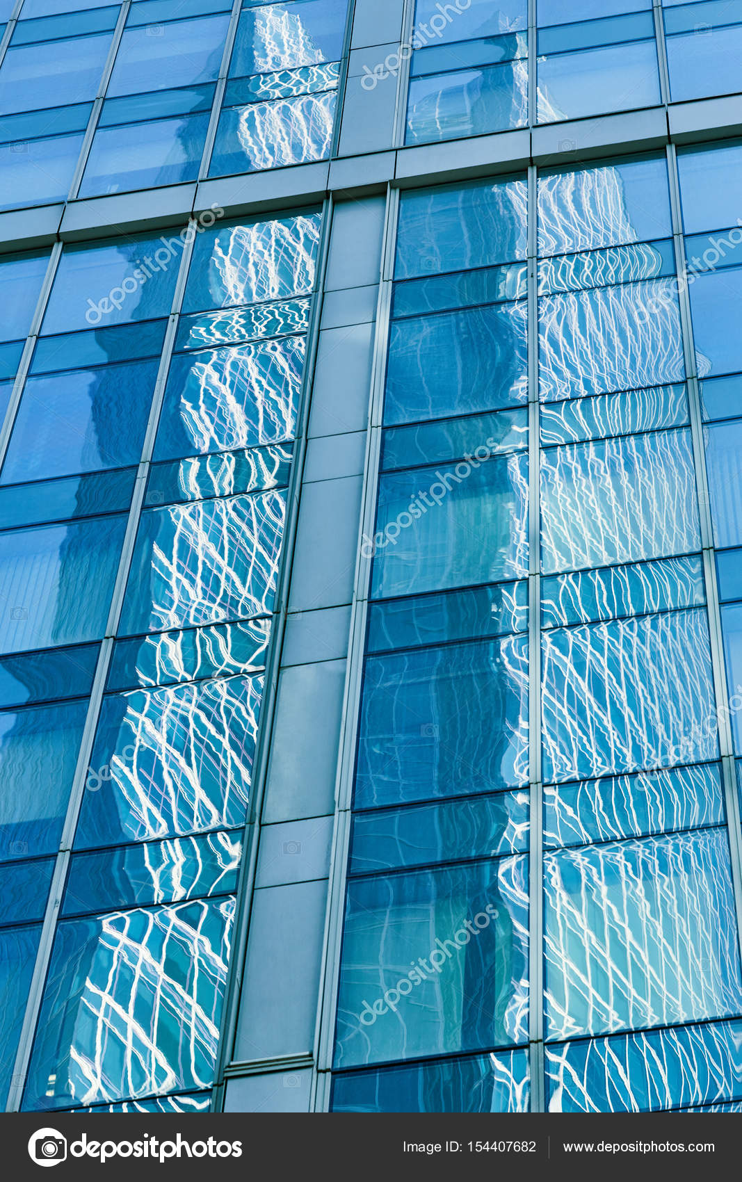 Reflection In Blue Glass Wall Of Modern Office Building Tint Bl