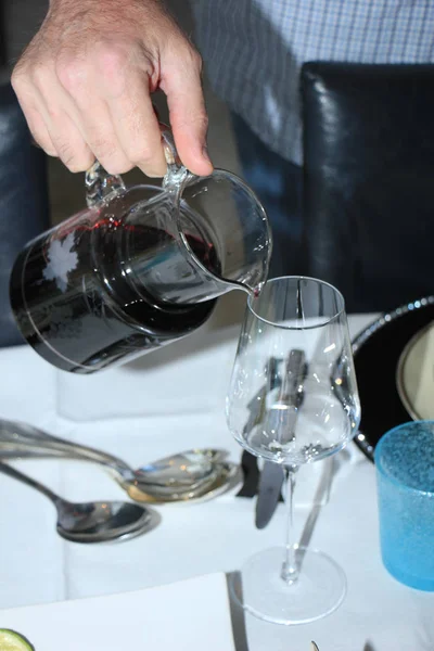 Man pouring red wine — Stock Photo, Image