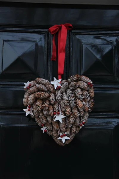 Christmas decoration on front door — Stock Photo, Image