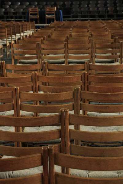 Wooden chairs in a church — Stock Photo, Image