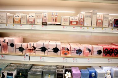 Amsterdam Schiphol Airport, the Netherlands - april 14th 2018: different brands of perfume clipart