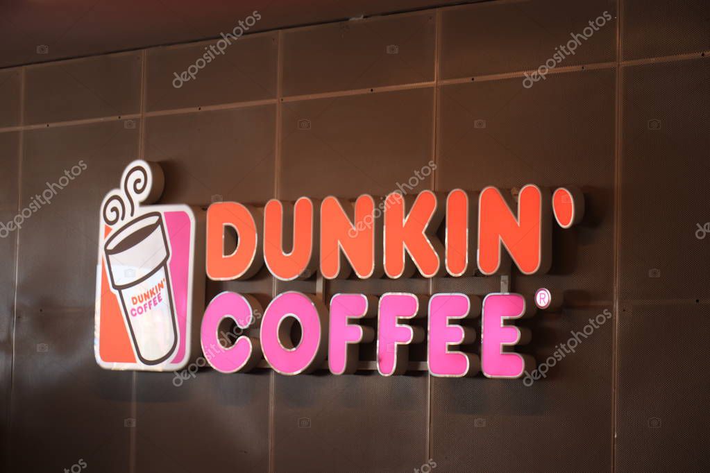 Barcelona, Spain - september 29th 2019: Dunkin Coffee shop in Maremagnum shopping mall in Barcelona. Dunkin Donuts is an American multinational coffee and donut company and quick service restaurant.