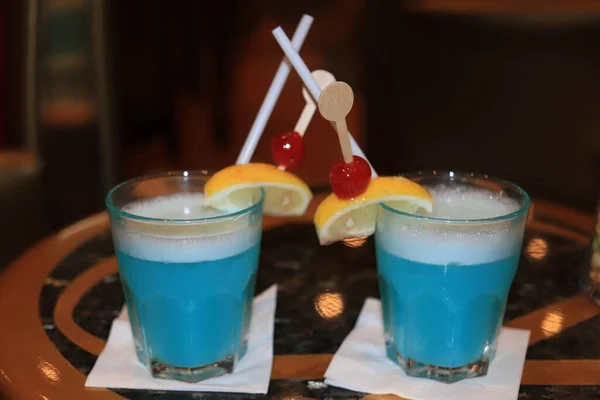 Blue cocktail with fruits