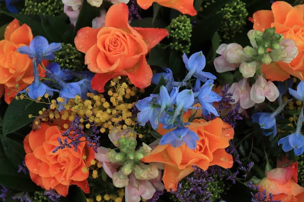 Orange and blue flower arrangement for a wedding — Stock Photo, Image