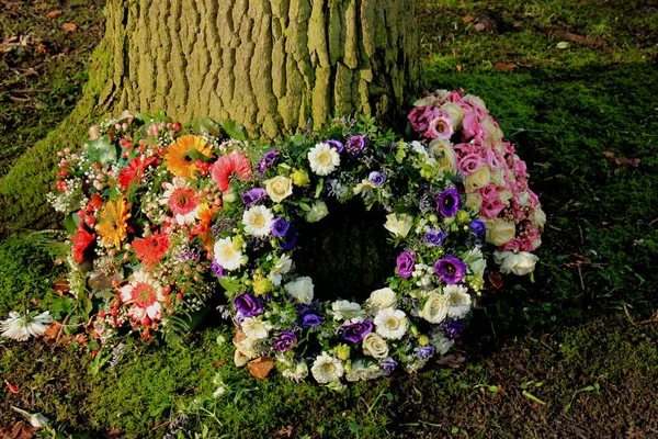 Sympathy wreath near a tree