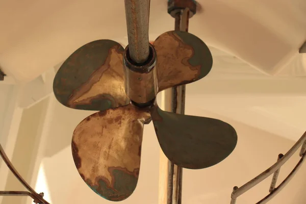 A brass ship propeller, belonging to a safety vessel on a cruise ship