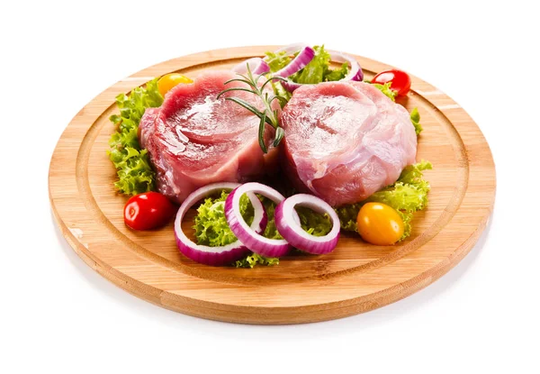 Fresh raw pork on cutting board on white background — Stock Photo, Image