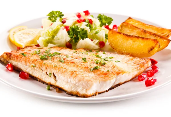 Grilled salmon with potatoes on white background Stock Photo