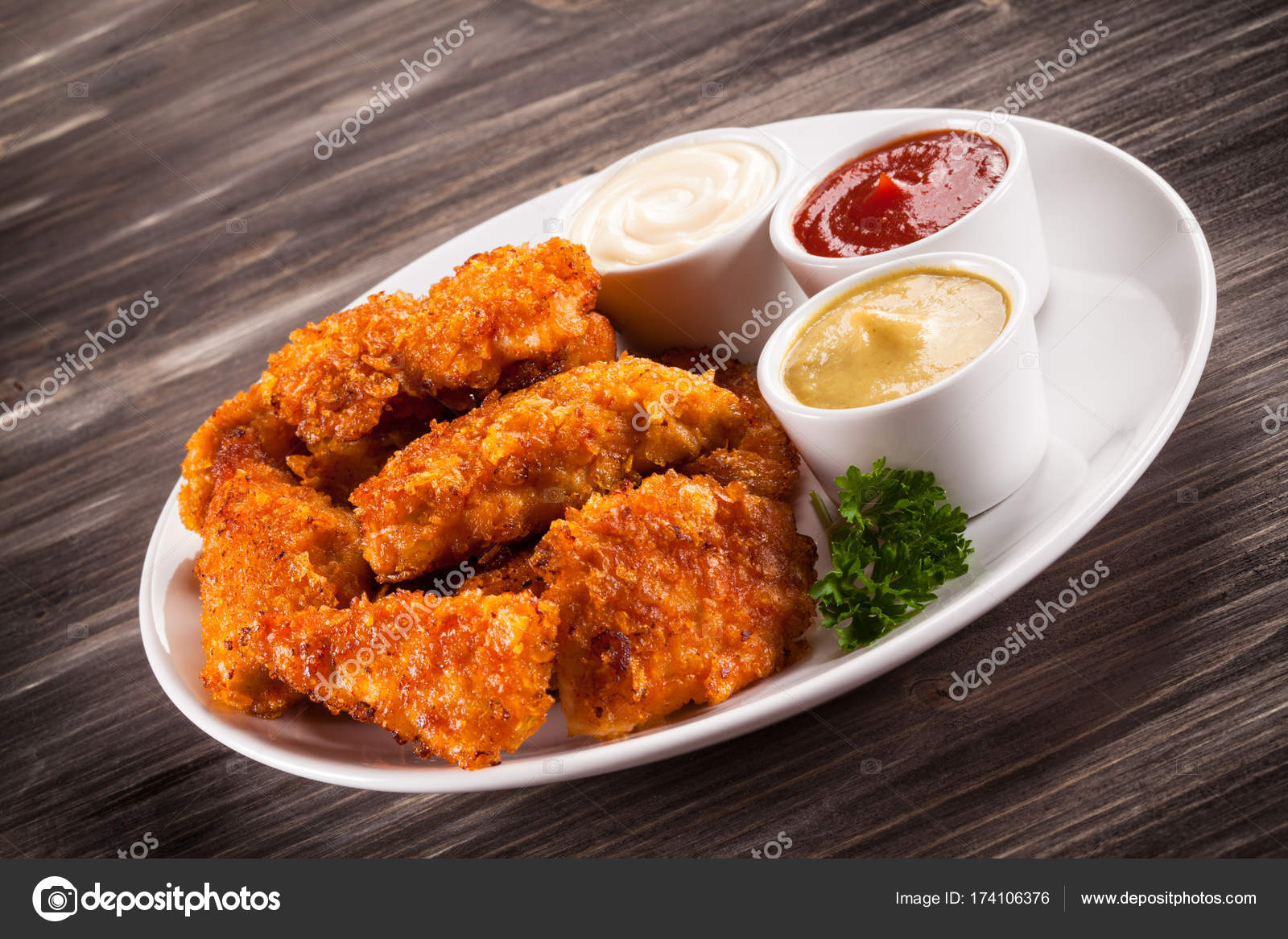 Fried chicken nuggets on wooden background — Stock Photo © gbh007