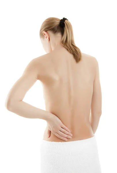 Mulher massageando dor nas costas — Fotografia de Stock