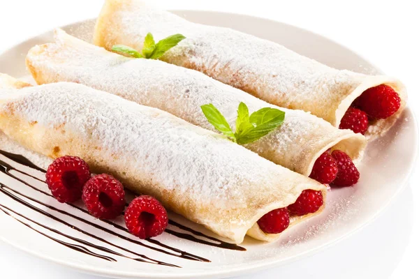 Crepes with raspberries and cream Stock Photo