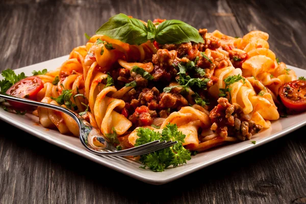 Pasta with meat, tomato sauce and vegetables