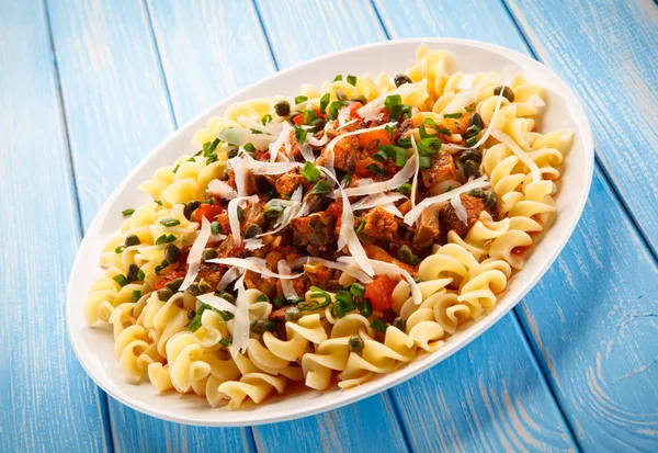 Pasta with meat, tomato sauce and vegetables