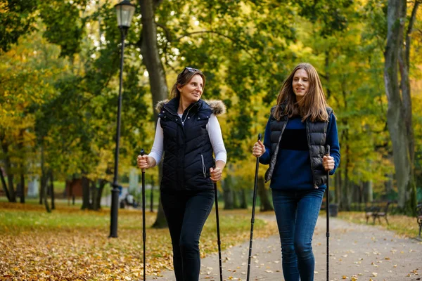 Mother Daughter Walking Together Autumnal Park Using Tourists Sticks Nordic — Stock Photo, Image