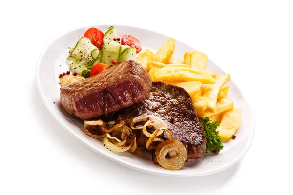 Beef Steaks French Fries Caramelized Onion Sauce Vegetables — Stock Photo, Image