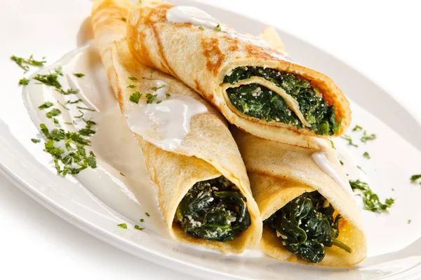 Pancakes Stuffed Spinach Served White Plate Sour Cream — Stock Photo, Image