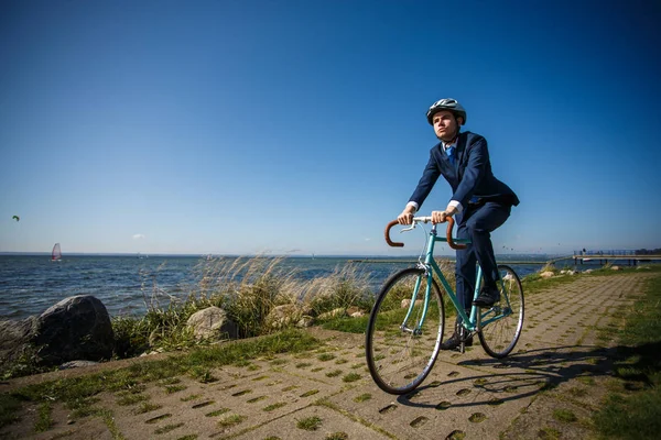 Man Suit Helmet Riding Bike Narrow Path Seaside — Stock Photo, Image