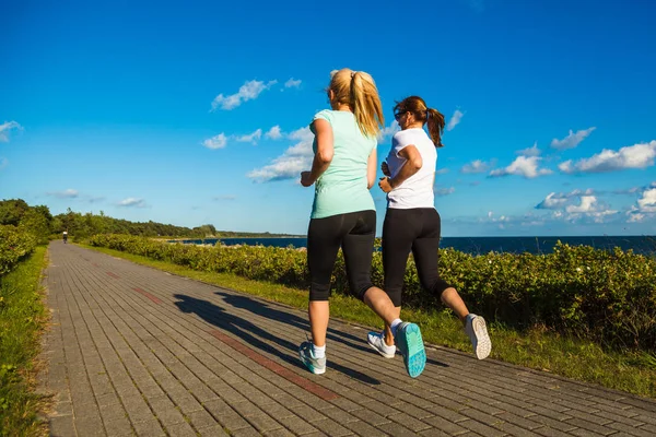 Two Middle Aged Women Running Together — Stock Photo, Image