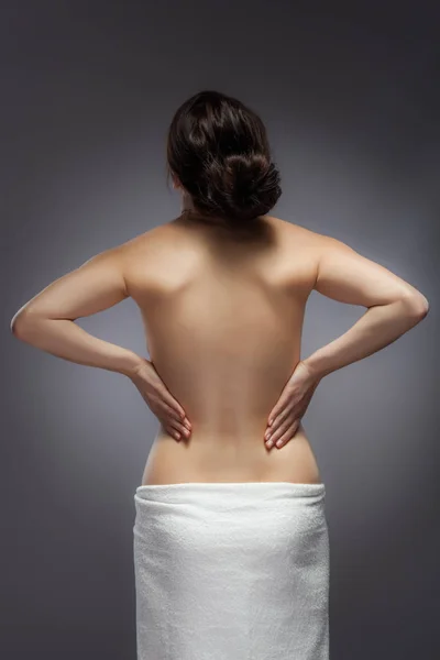 Young Woman Feeling Lower Back Pain Grey Background — Stock Photo, Image