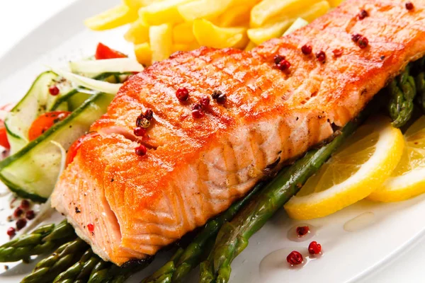 Grilled salmon with french fries and asparagus