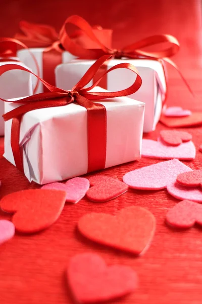 Gifts with  ribbons and hearts — Stock Photo, Image