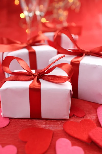 Gifts with red ribbons — Stock Photo, Image