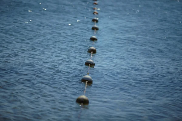 Buoys on surface of sea — Stock Photo, Image