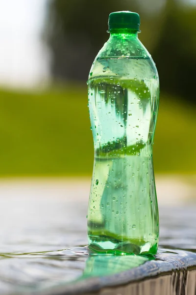 water in the green bottle