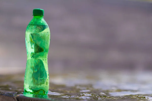 water in the green bottle