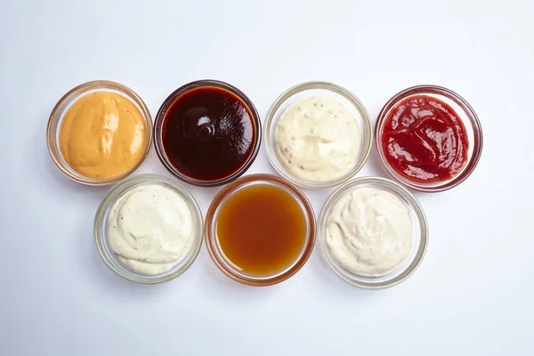 Tasty sauces in jars — Stock Photo, Image