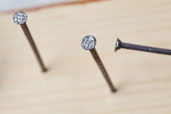 Nails on the wood panel — Stock Photo, Image