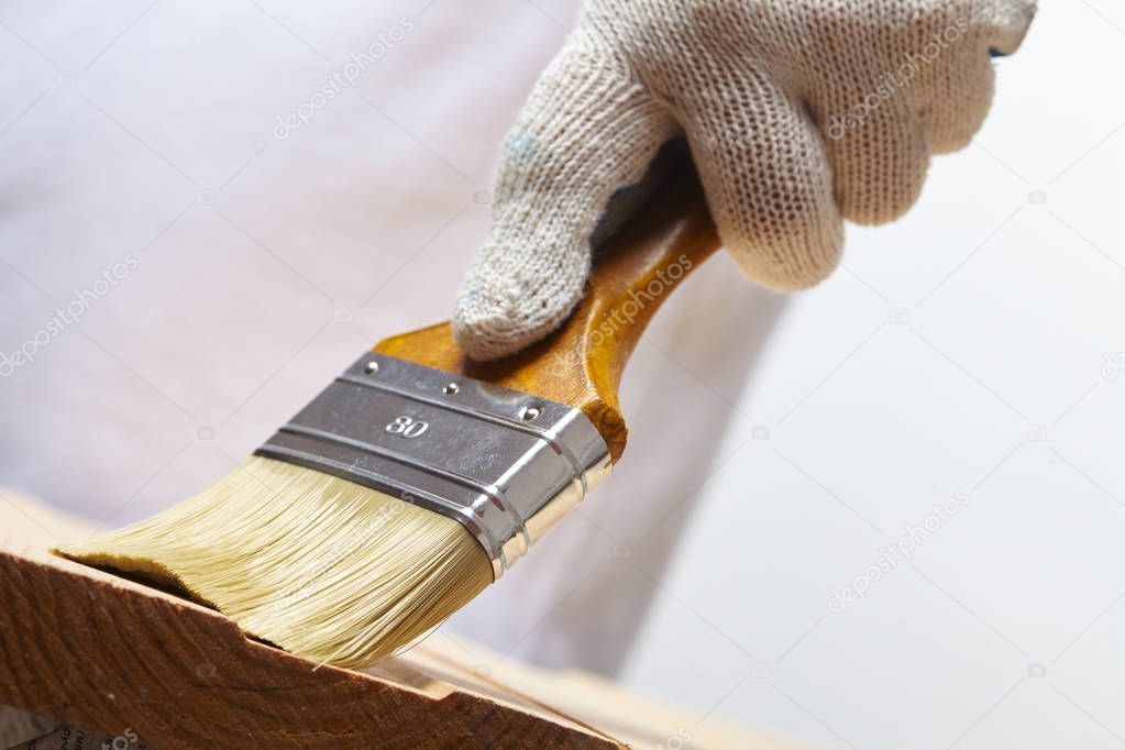 man working with brush
