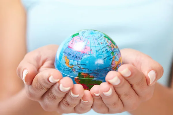 woman\'s hands with globe
