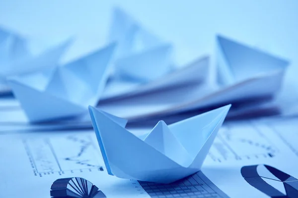 Paper boats on  documents — Stock Photo, Image